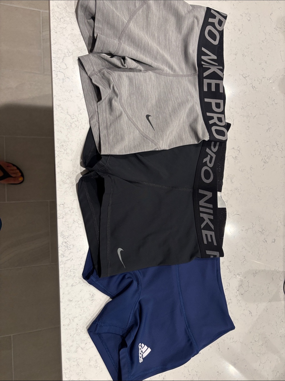 Nike Compression Shorts 2-Pack in Gray, Black. 1 blue Adidas shorts.